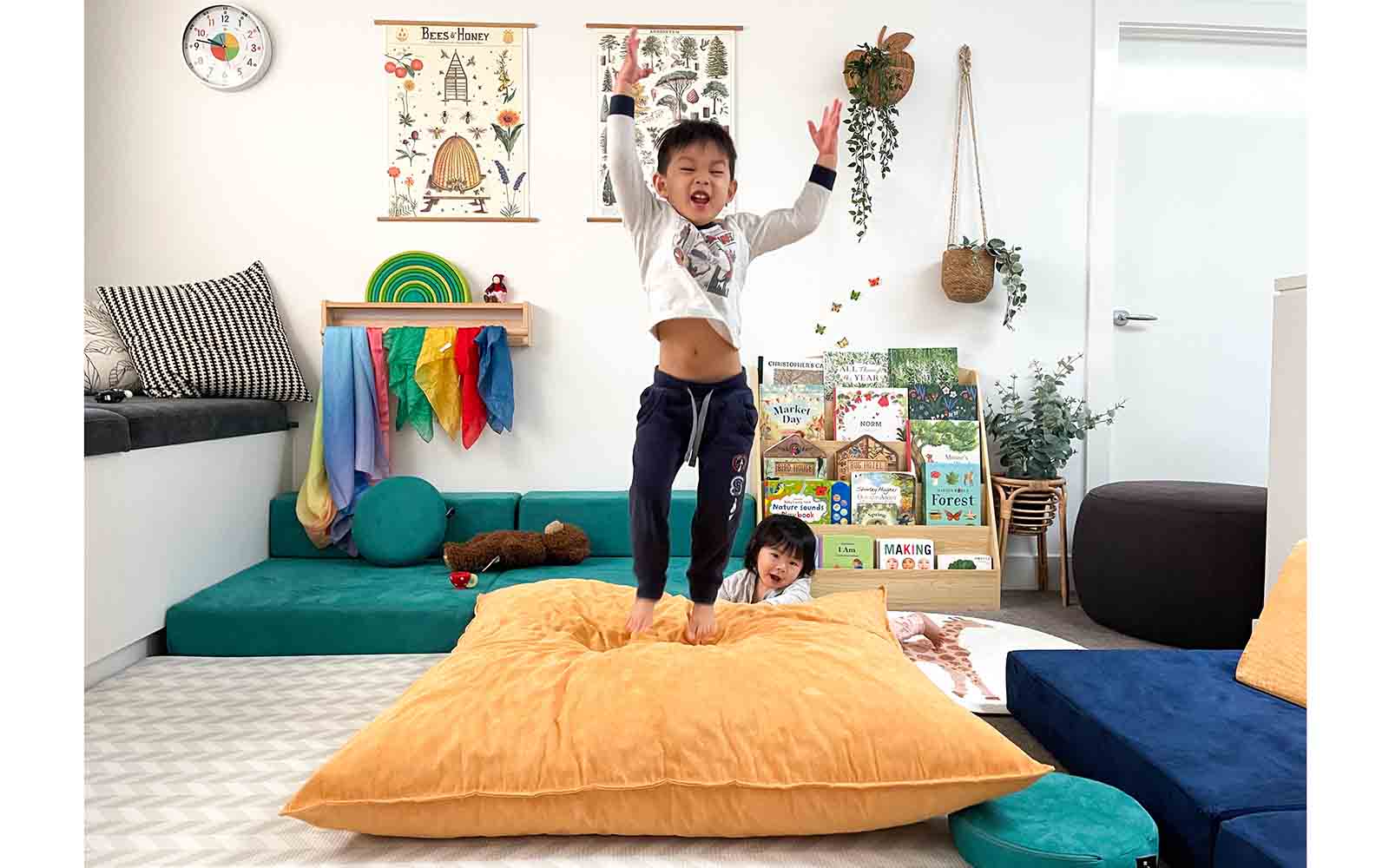A soft Funsquare crash pad on a playroom floor